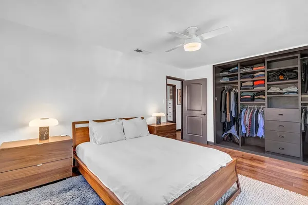 a bedroom with a bed and a closet