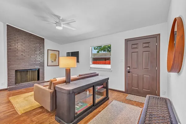 a living room with furniture and a fireplace