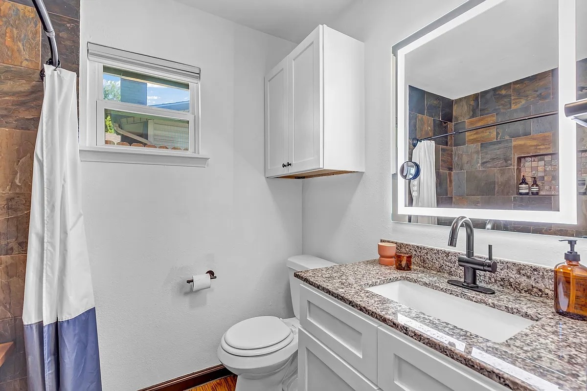 2307 Teri Road Austin, TX 78744 - Photo 17 of 28 Full bath featuring a tile shower and vanity