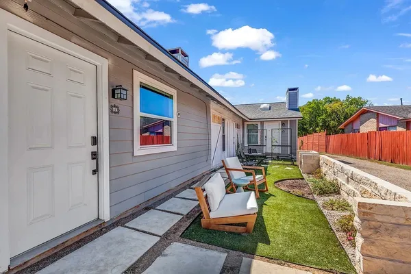 a backyard of a house with seating space