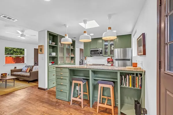 a kitchen with a sink and cabinets