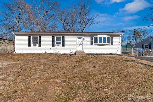 a house with trees in the background