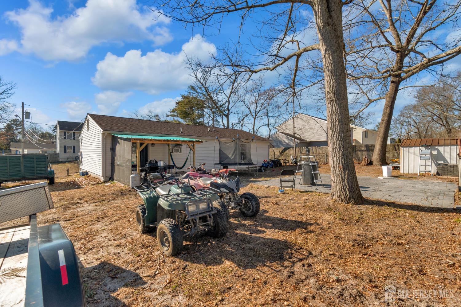 135 Hanover Street Pemberton, NJ 08068 - Photo 15 of 17 a view of a house with backyard and sitting area