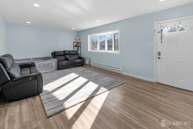 a living room with furniture and a window