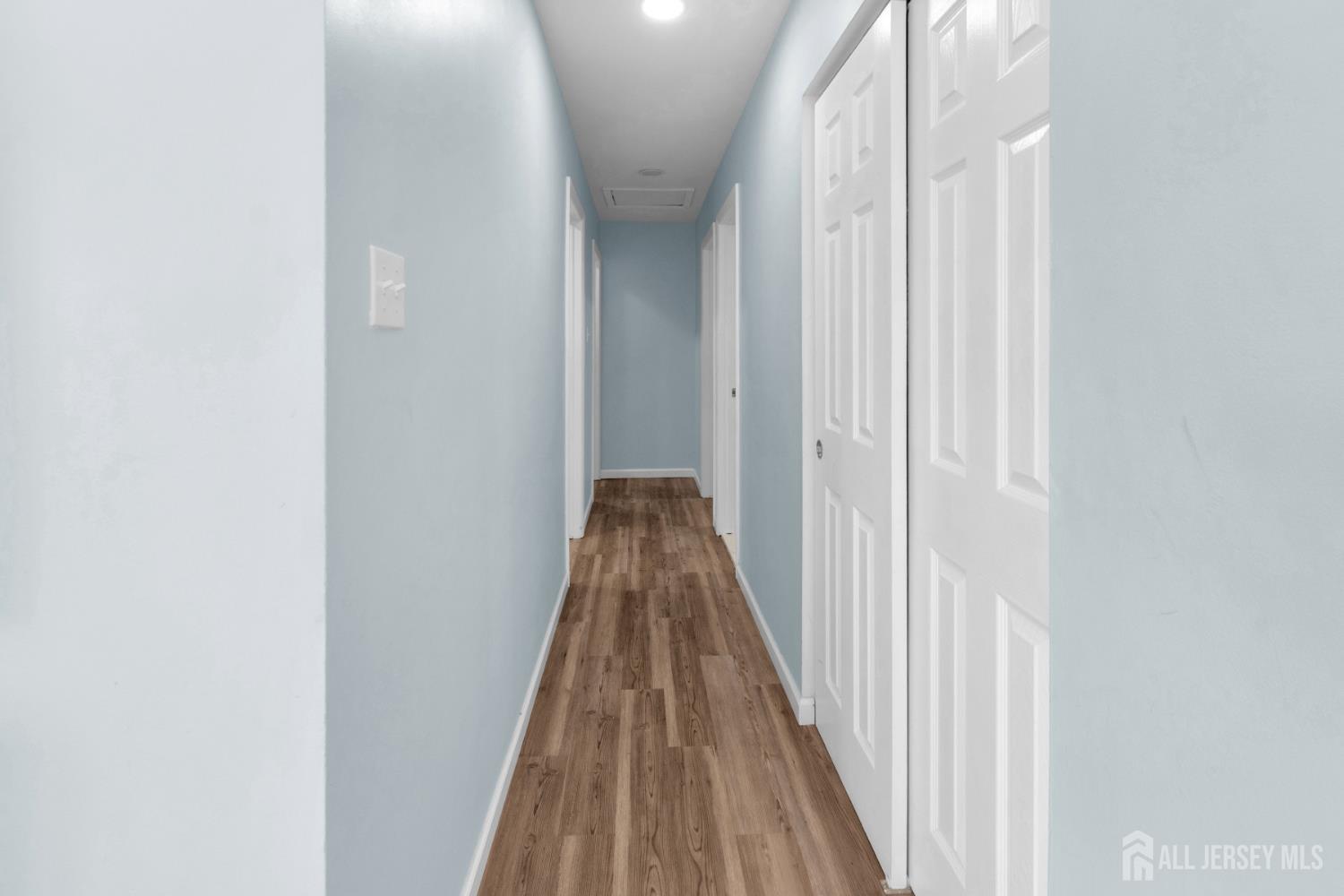 135 Hanover Street Pemberton, NJ 08068 - Photo 8 of 17 a view of a hallway with wooden floor