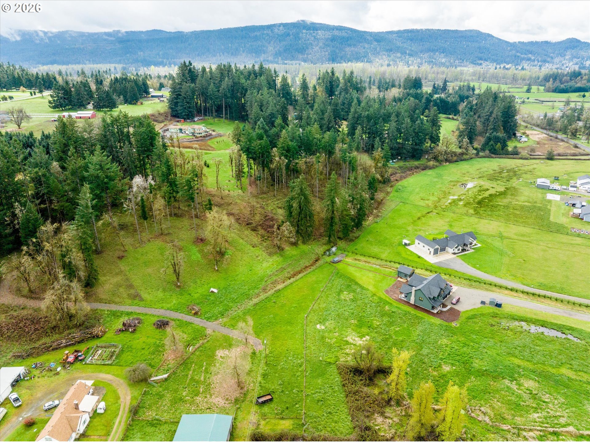 Worth Springfield, OR 97478 - Photo 8 of 24 a view of a lush green hillside and a houses