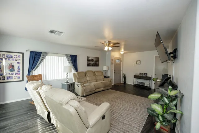 a living room with furniture and a large window