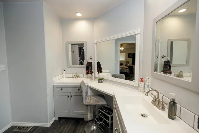 a bathroom with a sink double vanity and a mirror