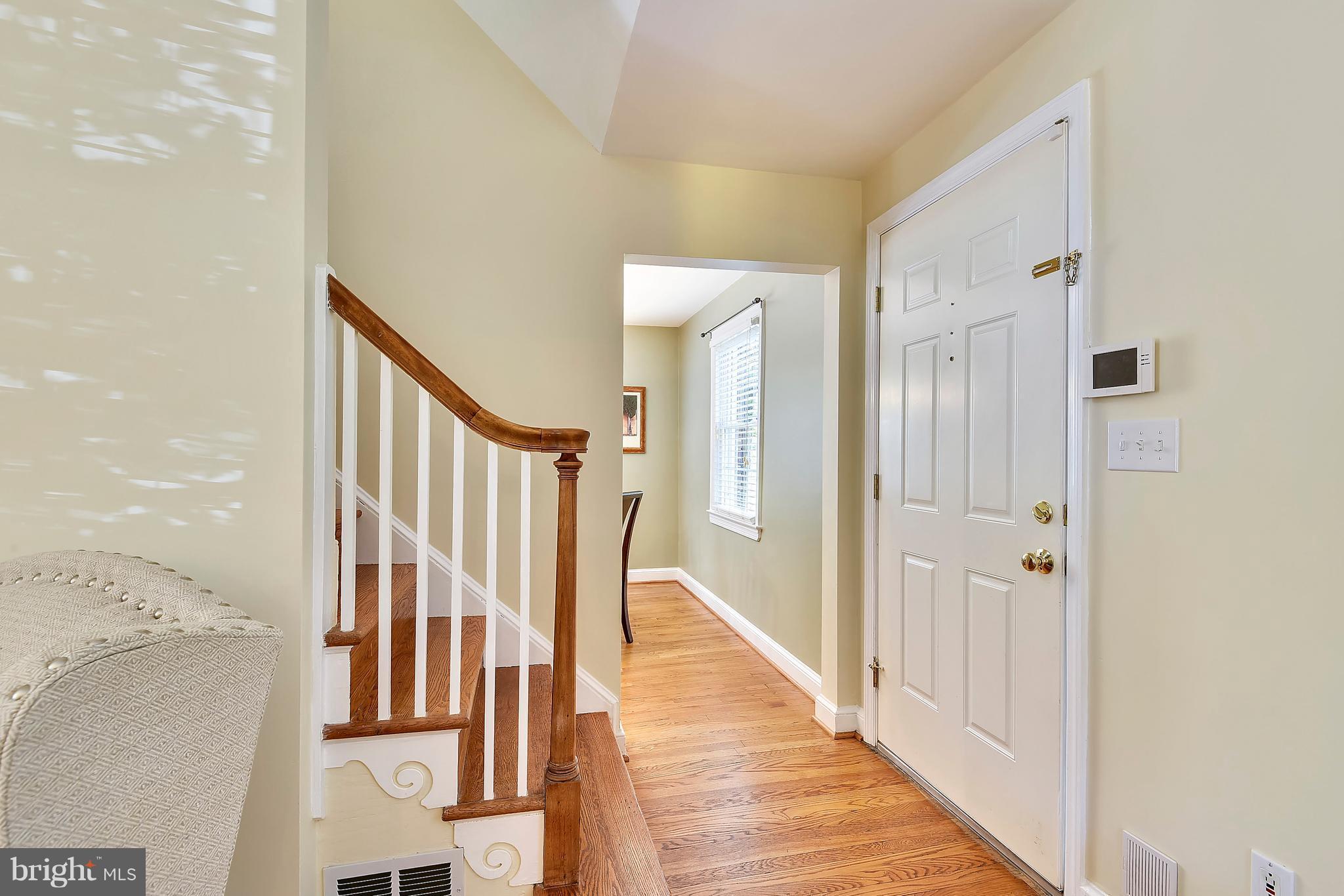 10001 Raynor Road Silver Spring, MD 20901 - Photo 2 of 30 a view of a hallway with wooden floor and staircase