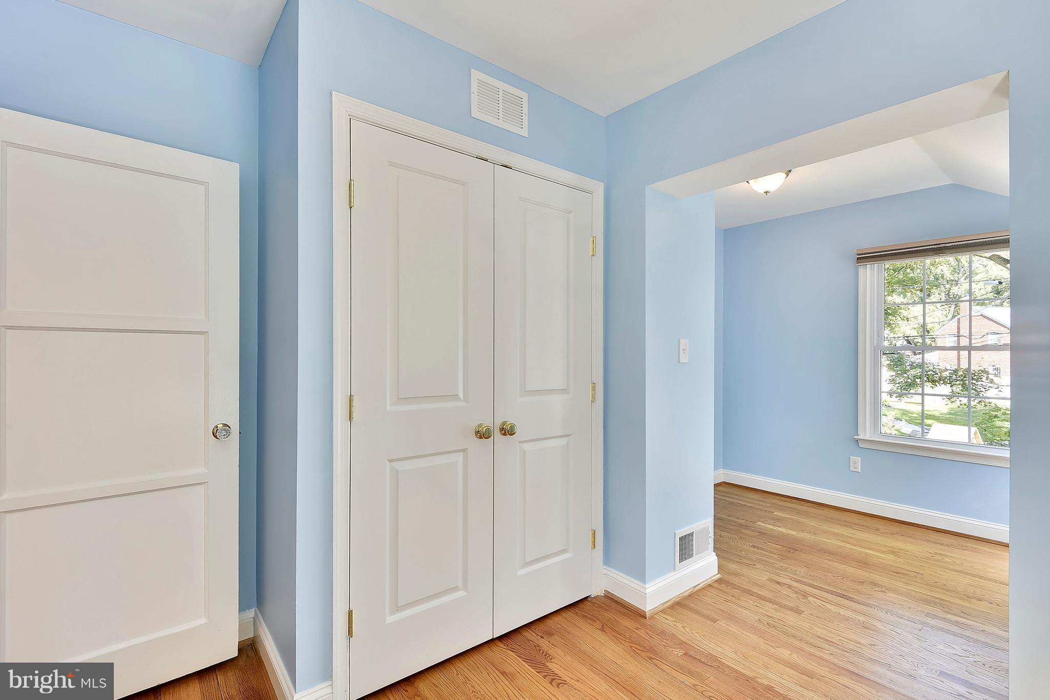 10001 Raynor Road Silver Spring, MD 20901 - Photo 15 of 30 a view of an empty room with wooden floor and a window