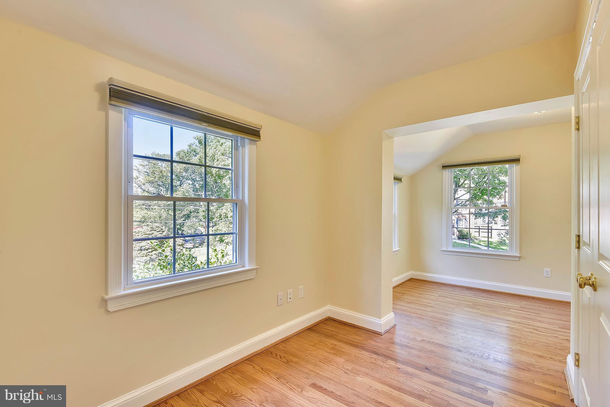 10001 Raynor Road Silver Spring, MD 20901 - Photo 16 of 30 a view of an empty room with wooden floor and a window