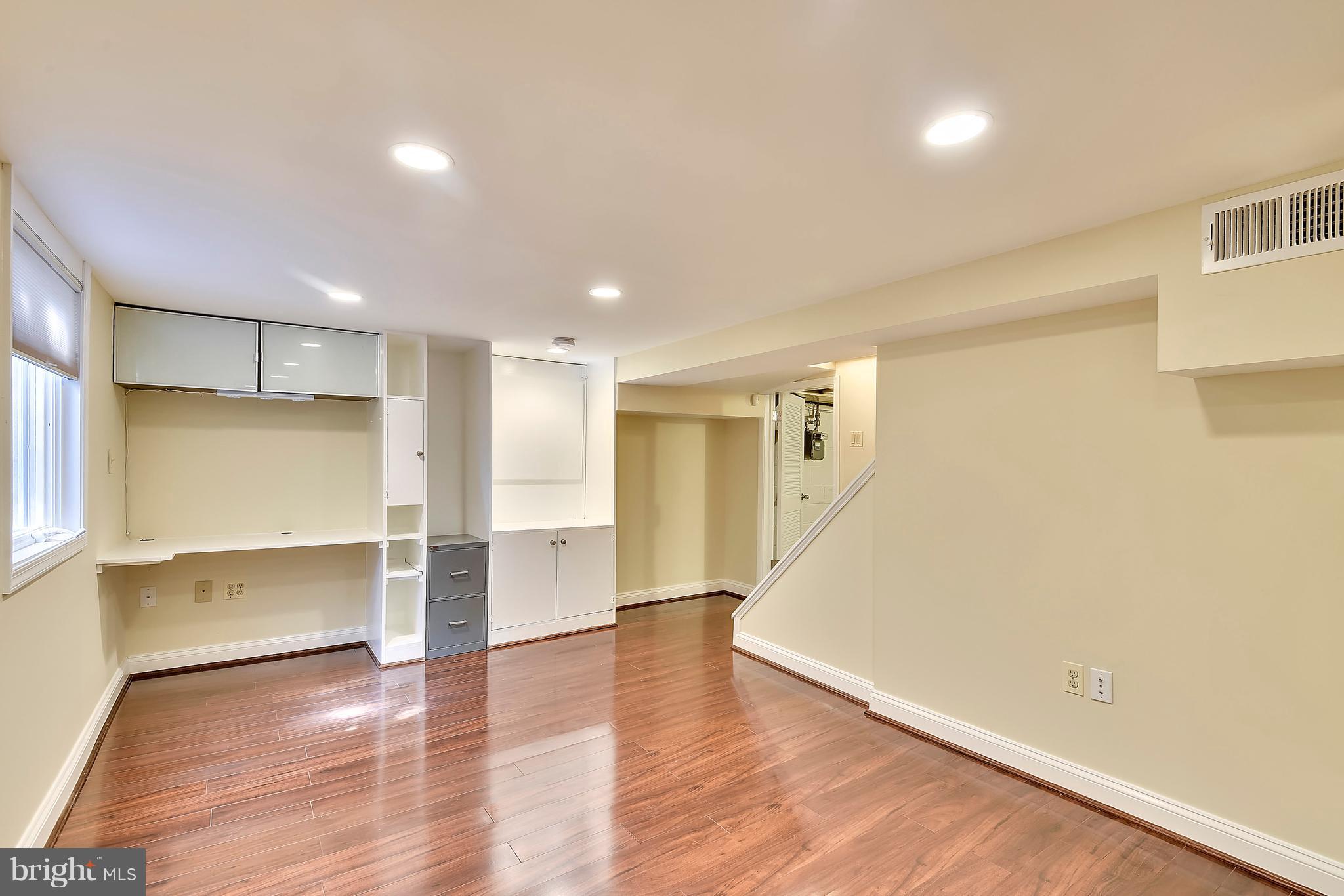 10001 Raynor Road Silver Spring, MD 20901 - Photo 18 of 30 a view of empty room with wooden floor and fan