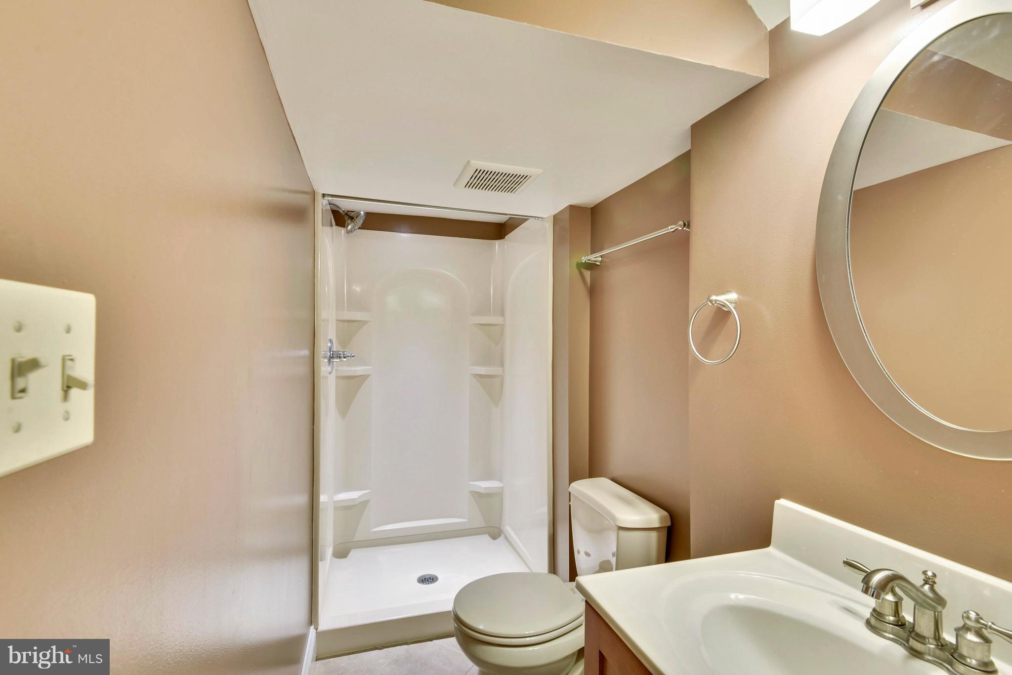 10001 Raynor Road Silver Spring, MD 20901 - Photo 20 of 30 a bathroom with a sink toilet and shower