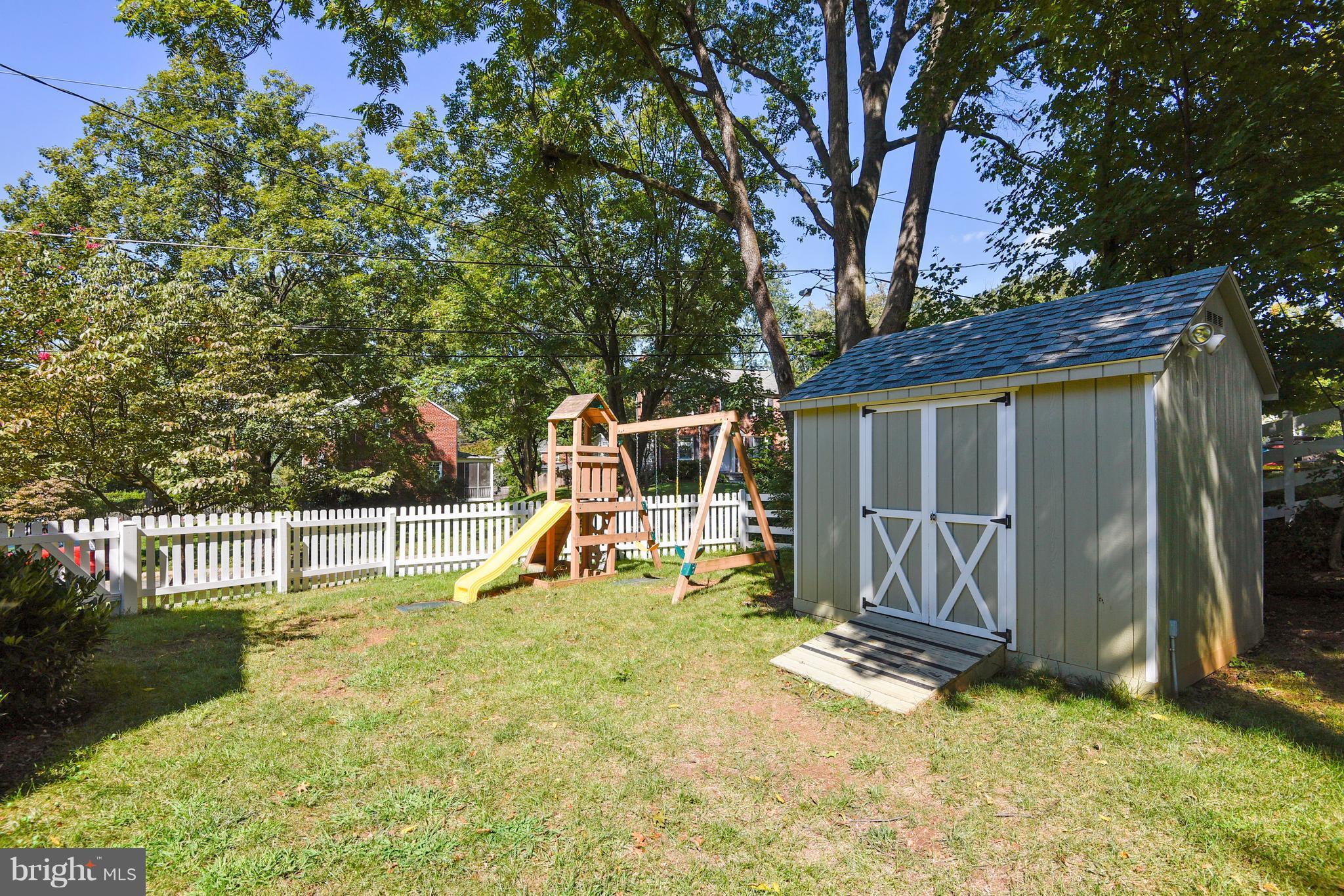 10001 Raynor Road Silver Spring, MD 20901 - Photo 23 of 30 a view of a house with backyard and a tree