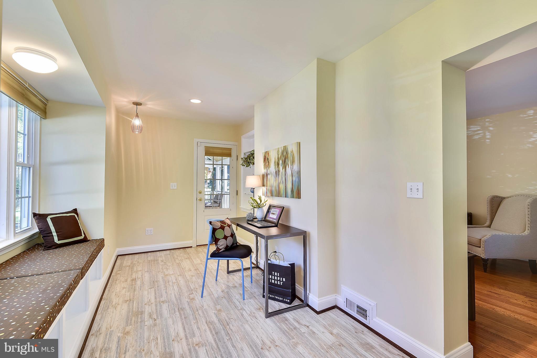 10001 Raynor Road Silver Spring, MD 20901 - Photo 6 of 30 a view of a hallway with wooden floor and a bedroom