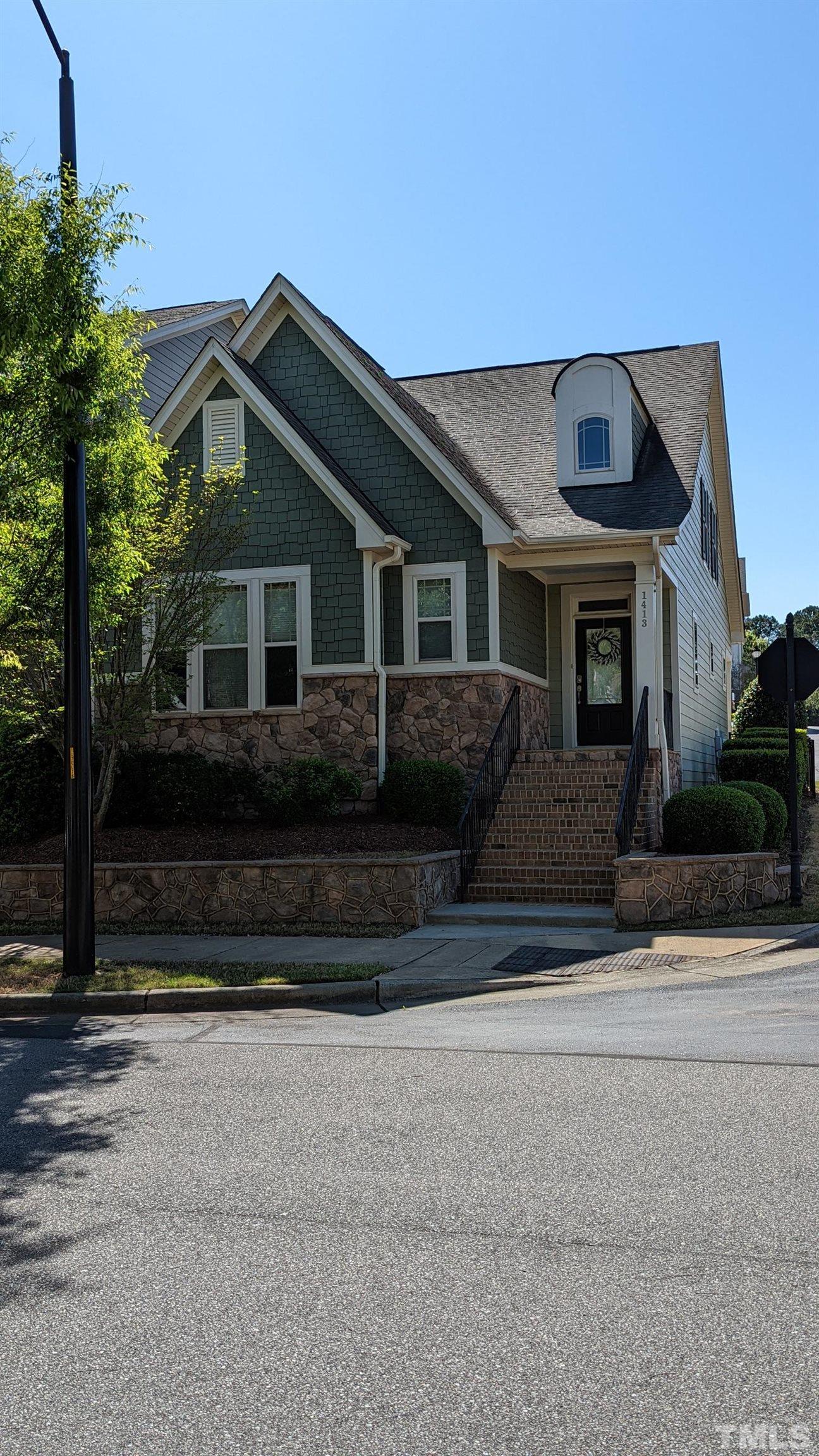 1413 Rodessa Run Raleigh, NC 27607 - Photo 1 of 36 a front view of a house with a yard