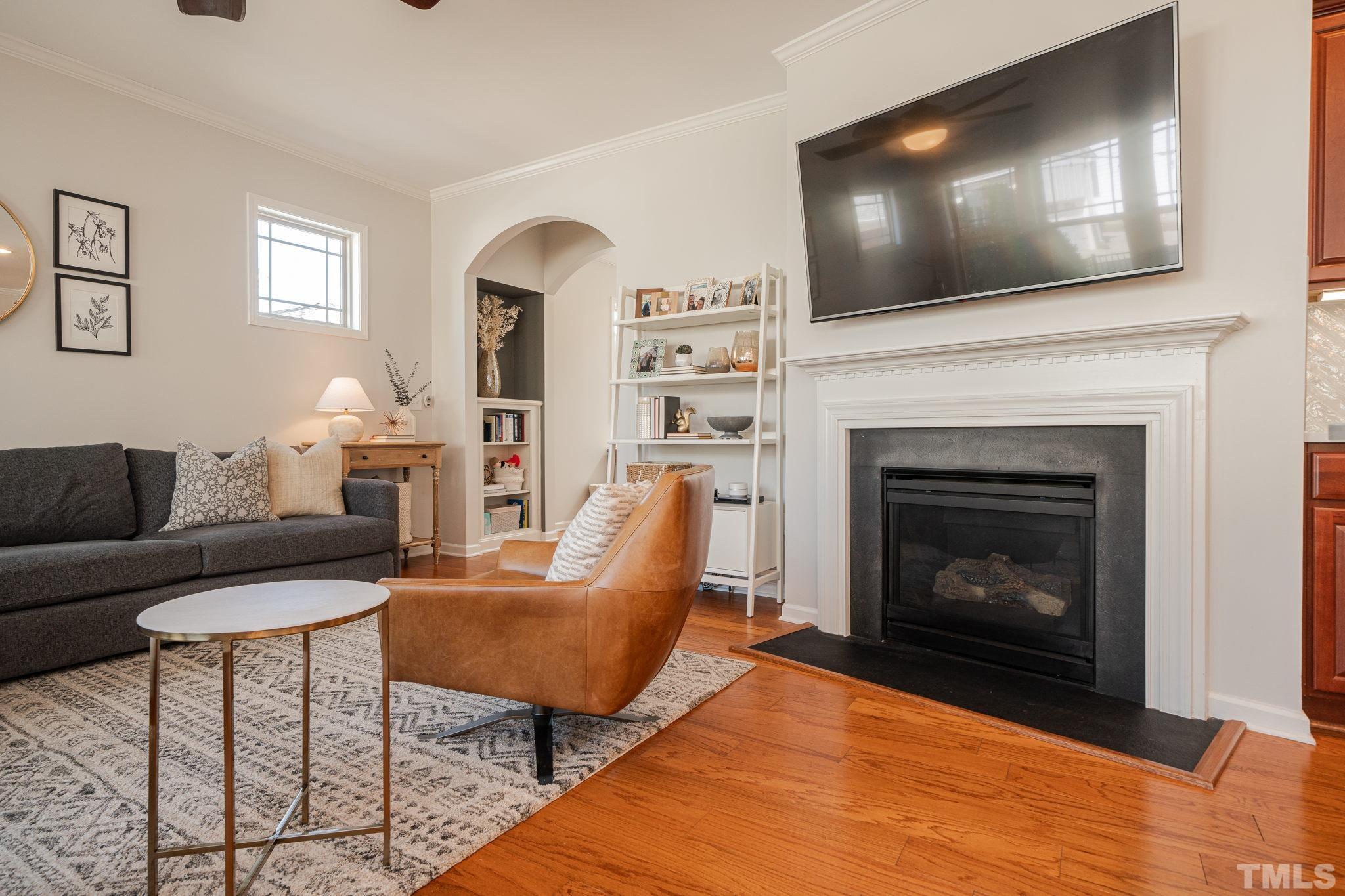 1413 Rodessa Run Raleigh, NC 27607 - Photo 27 of 36 a living room with furniture and a fireplace