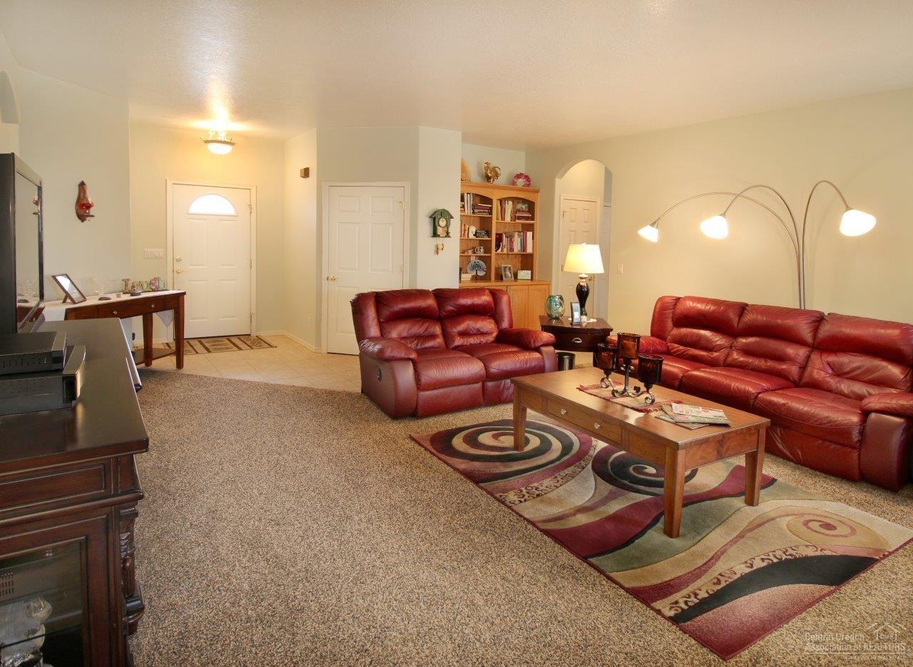 381 Southeast Soft Tail Loop Bend, OR 97702 - Photo 7 of 24 A warm and inviting living room. Note t