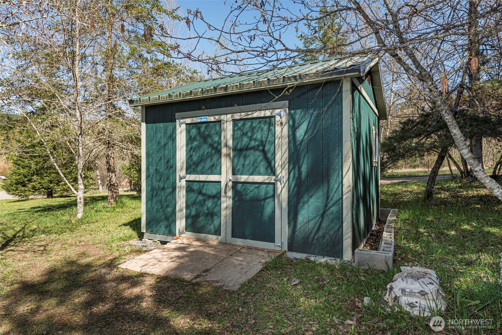 4890 Lost Mountain Road Sequim, WA 98382 - Photo 17 of 36 a backyard of a house with lots of green space