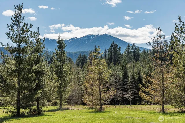 a view of a swimming pool with an outdoor space and seating area