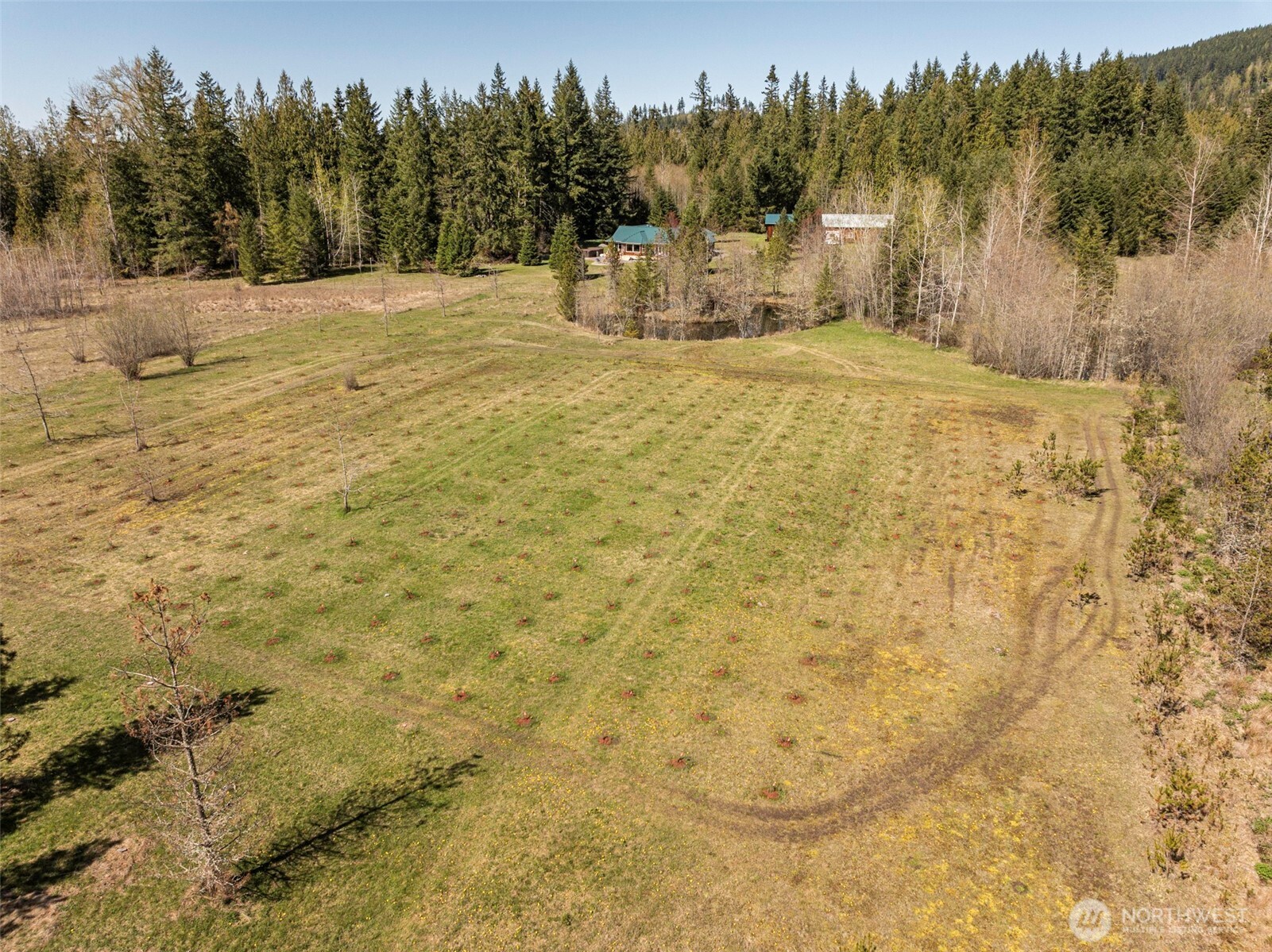 4890 Lost Mountain Road Sequim, WA 98382 - Photo 32 of 36 a view of a yard with a house