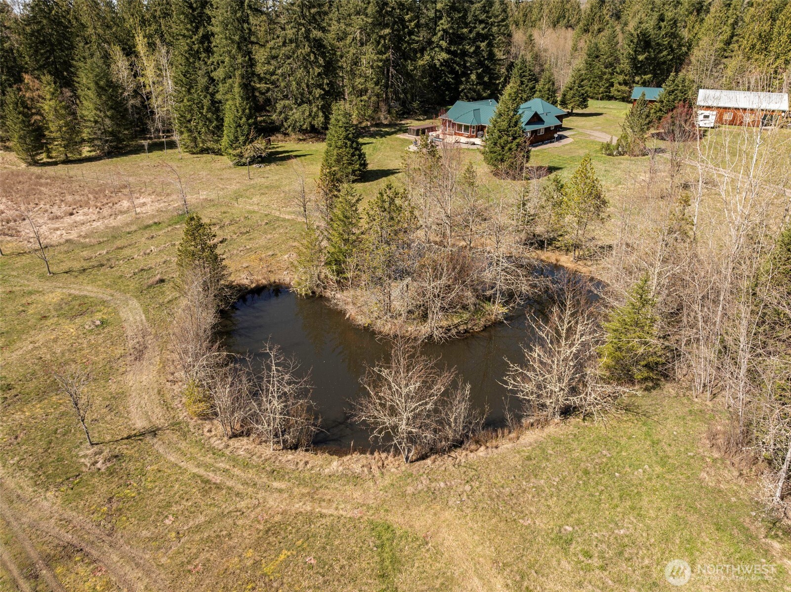 4890 Lost Mountain Road Sequim, WA 98382 - Photo 36 of 36 a view of a yard near a lake