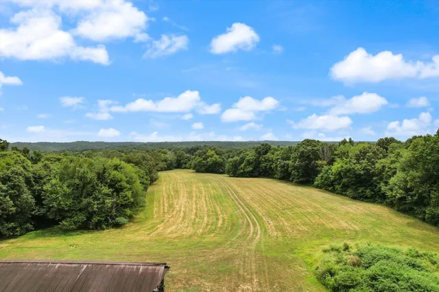 a view of swimming pool and mountain in the background