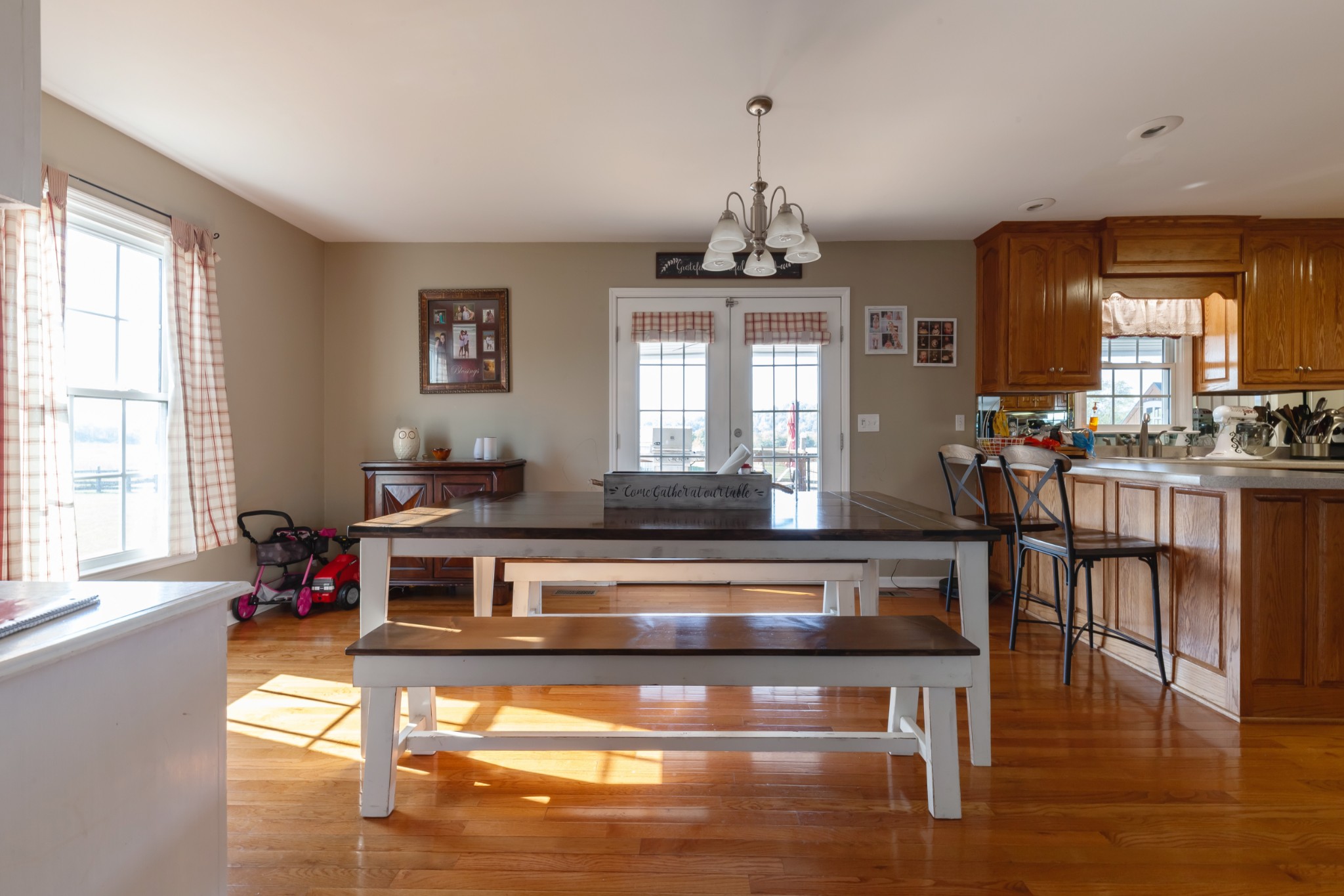 7055 Buford Station Road Lynnville, TN 38472 - Photo 11 of 34 a living room with kitchen island furniture and a wooden floor