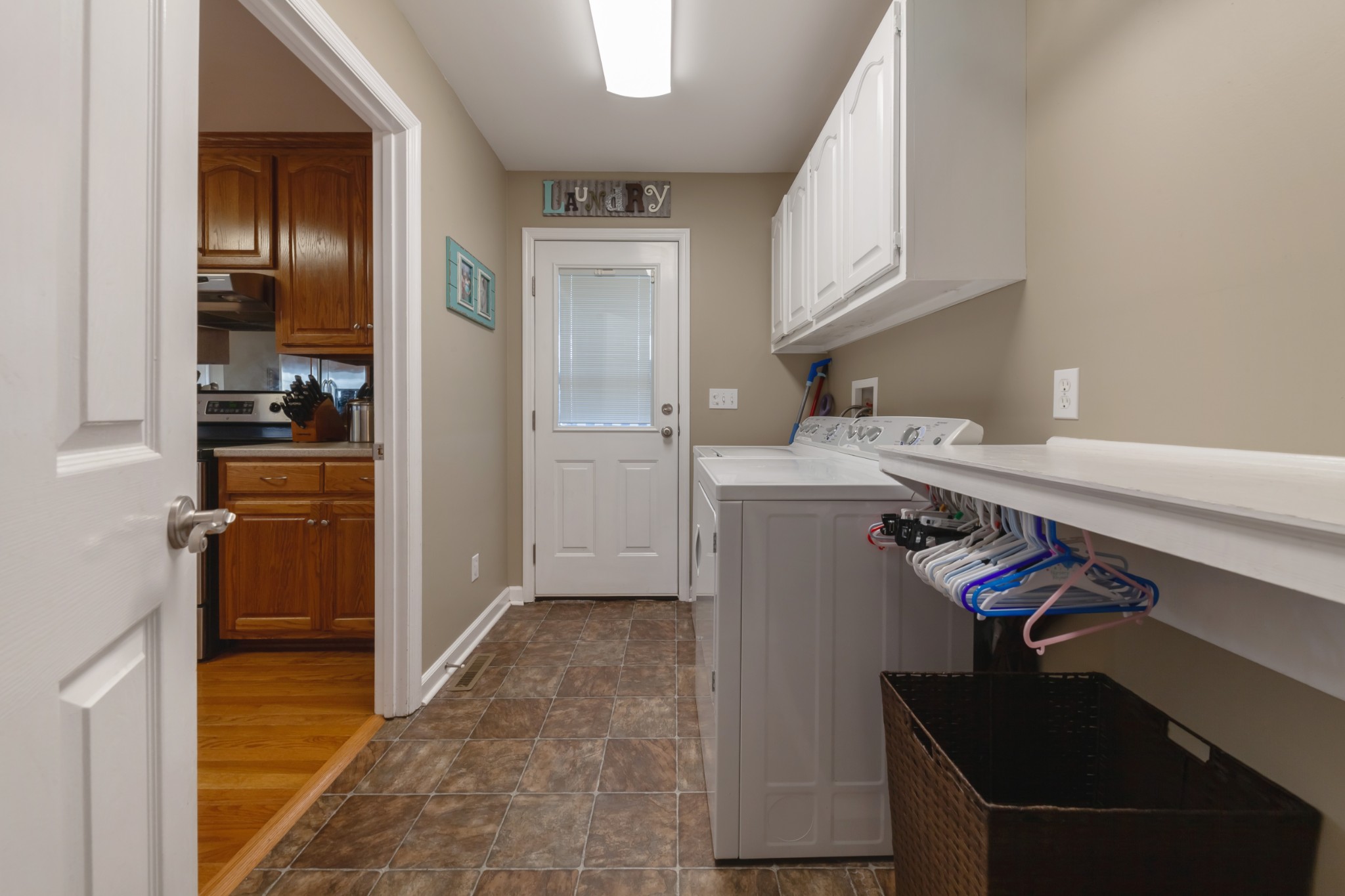 7055 Buford Station Road Lynnville, TN 38472 - Photo 17 of 34 a view of a kitchen with fridge and workspace
