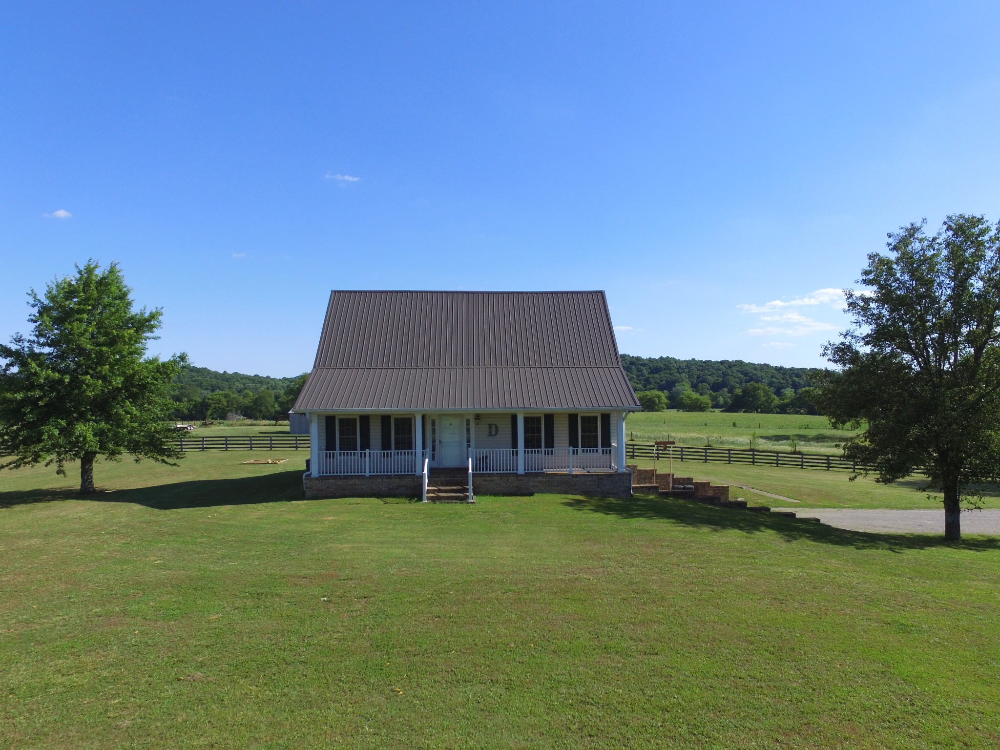7055 Buford Station Road Lynnville, TN 38472 - Photo 2 of 34 a view of a house with a big yard