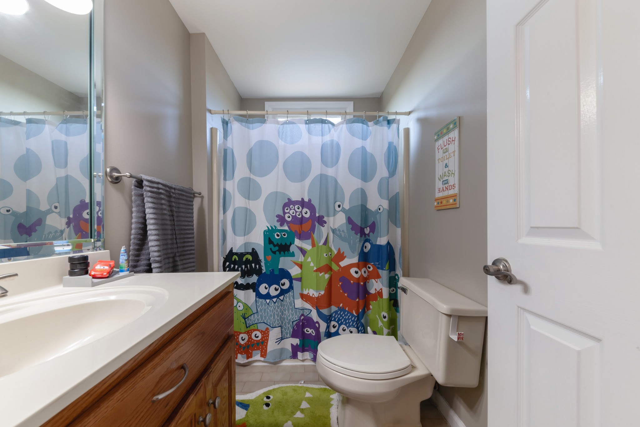 7055 Buford Station Road Lynnville, TN 38472 - Photo 25 of 34 a bathroom with a sink mirror vanity and toilet