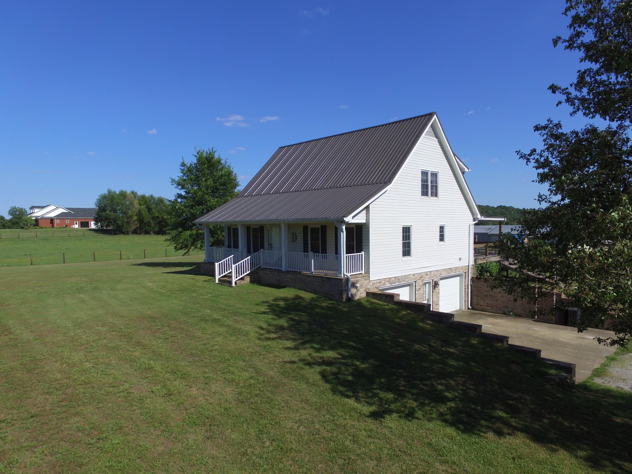 7055 Buford Station Road Lynnville, TN 38472 - Photo 27 of 34 a view of a house with a yard