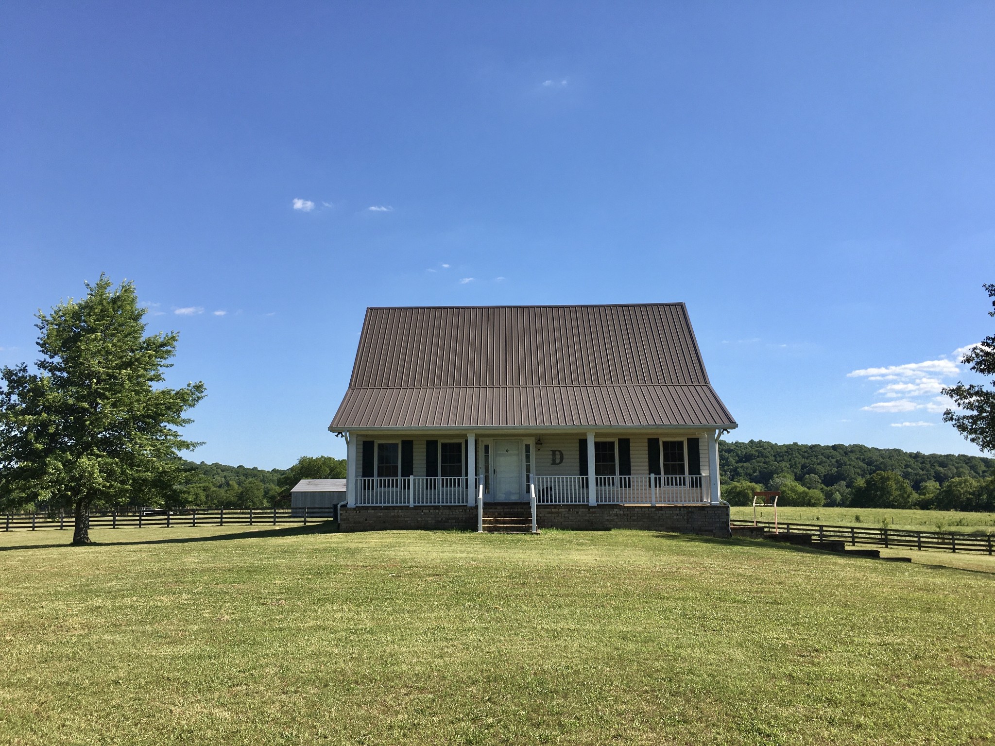 7055 Buford Station Road Lynnville, TN 38472 - Photo 29 of 34 a front view of a house with a yard