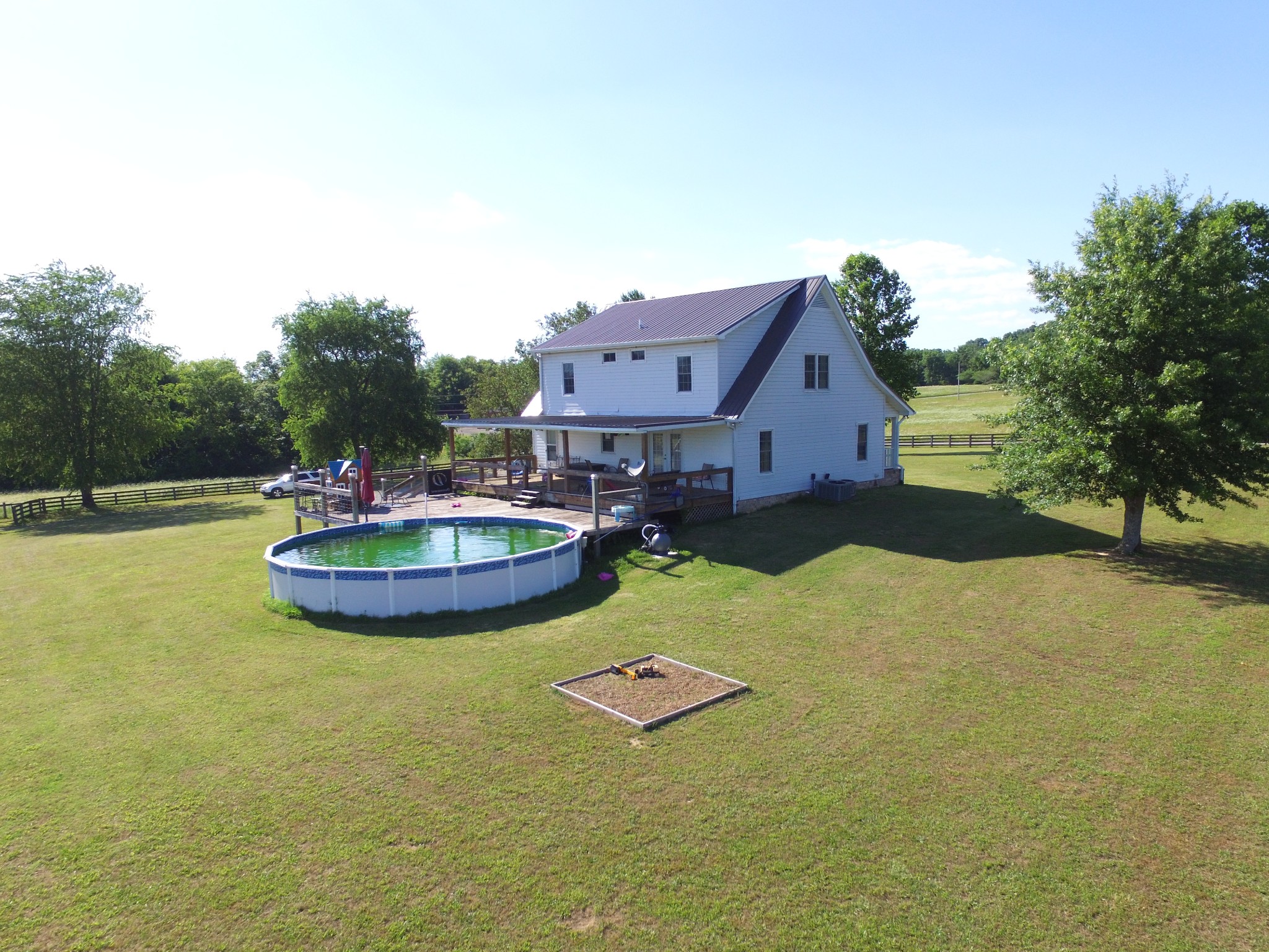 7055 Buford Station Road Lynnville, TN 38472 - Photo 30 of 34 a view of a house with swimming pool and a yard