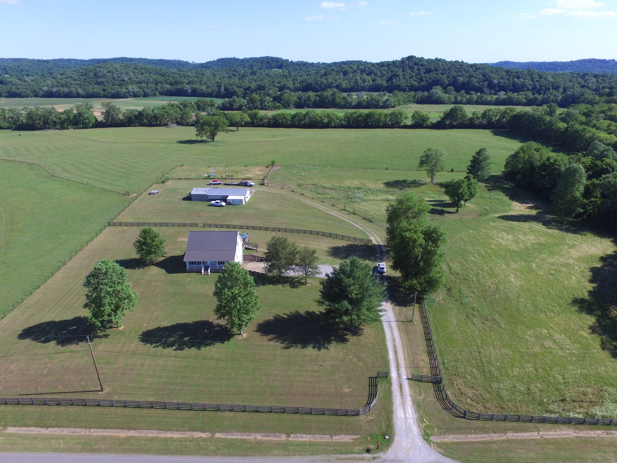7055 Buford Station Road Lynnville, TN 38472 - Photo 3 of 34 an aerial view of a house with a yard and lake view