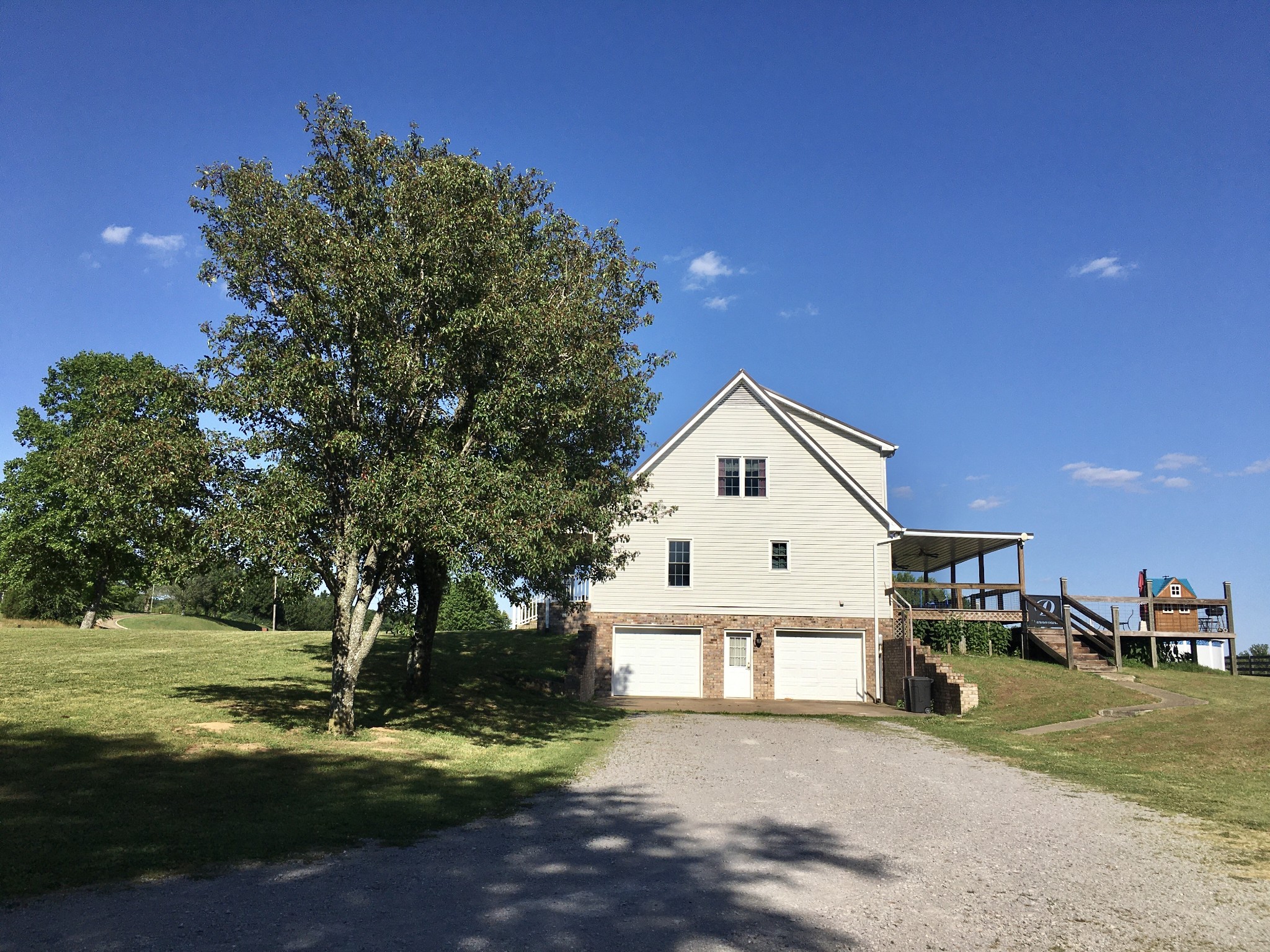 7055 Buford Station Road Lynnville, TN 38472 - Photo 32 of 34 a front view of a house with a garden