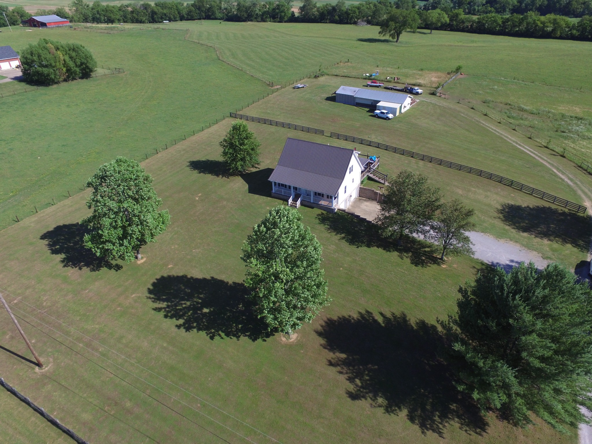 7055 Buford Station Road Lynnville, TN 38472 - Photo 4 of 34 an aerial view of a house with a yard and lake view