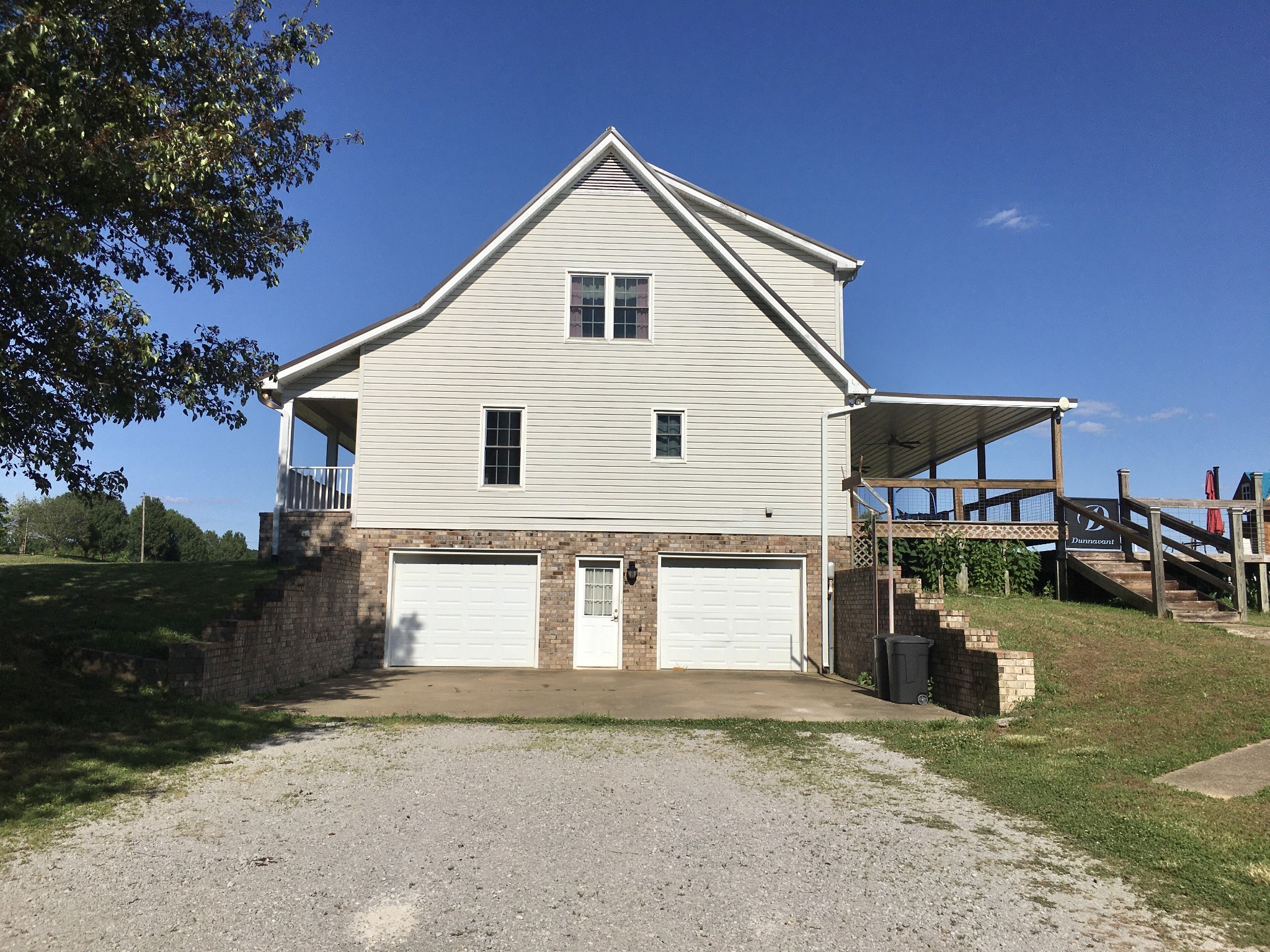 7055 Buford Station Road Lynnville, TN 38472 - Photo 7 of 34 a view of a house with a patio