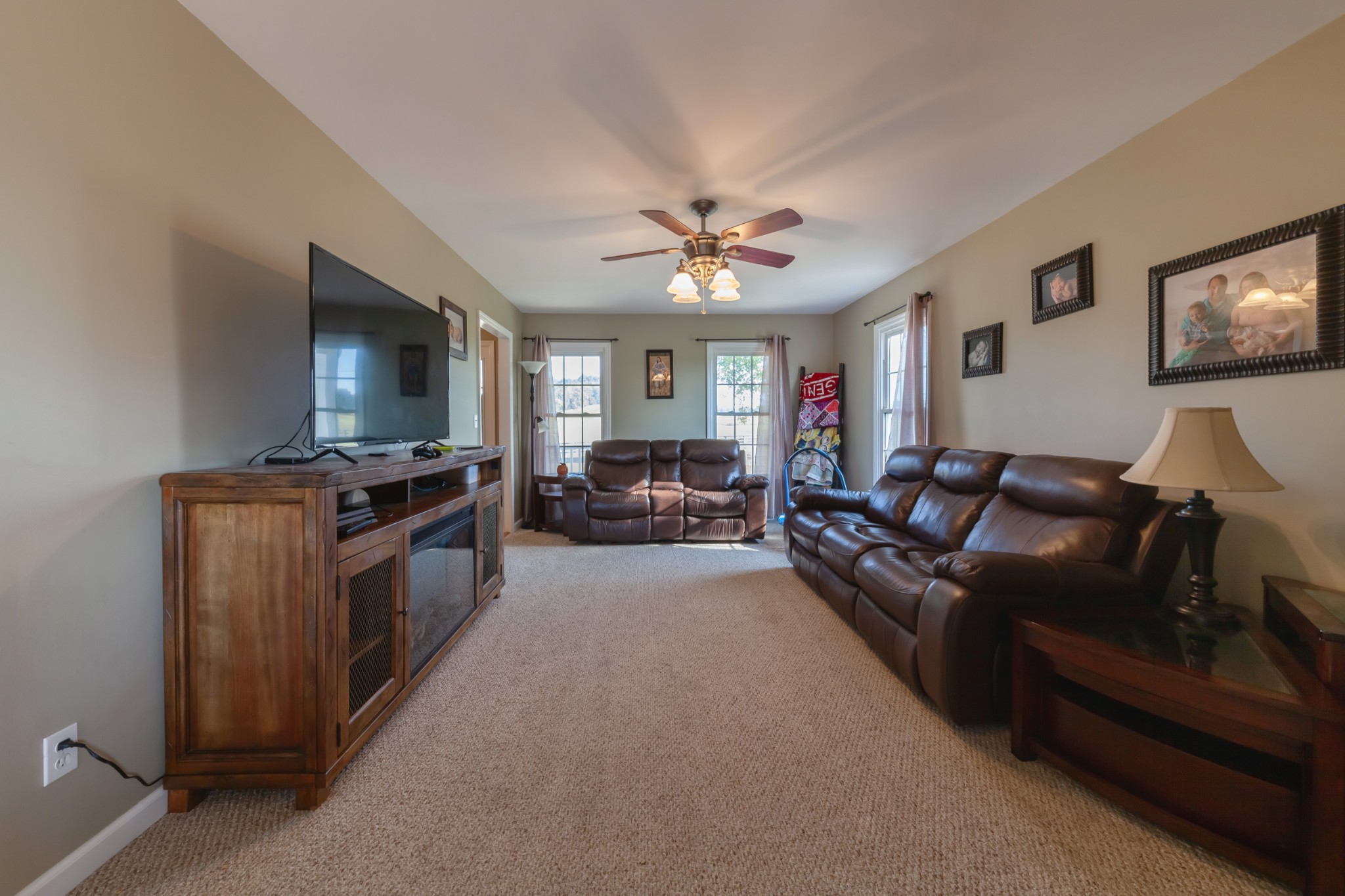 7055 Buford Station Road Lynnville, TN 38472 - Photo 10 of 34 a living room with furniture and a flat screen tv