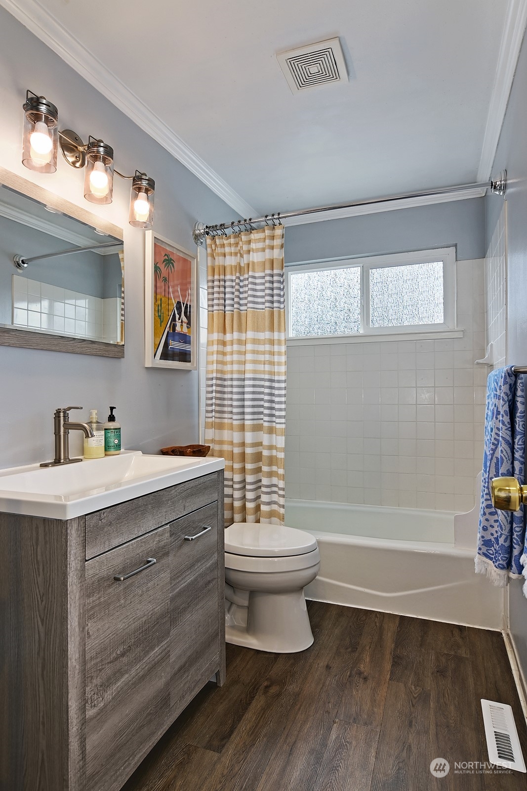 12728 Southeast 163rd Street Renton, WA 98058 - Photo 15 of 40 a bathroom with a sink toilet a mirror and bathtub