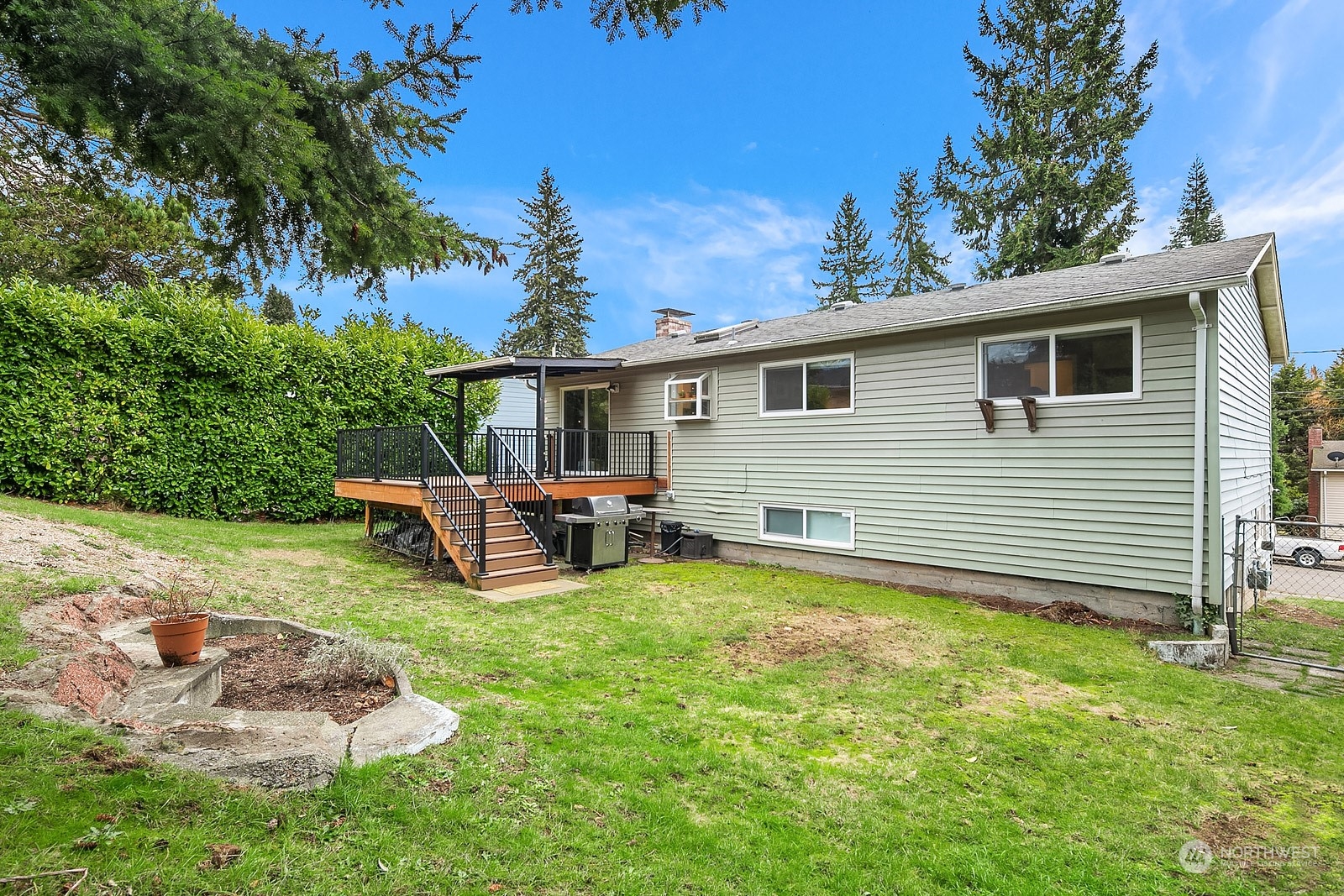 12728 Southeast 163rd Street Renton, WA 98058 - Photo 24 of 40 a view of a backyard with furniture and garden