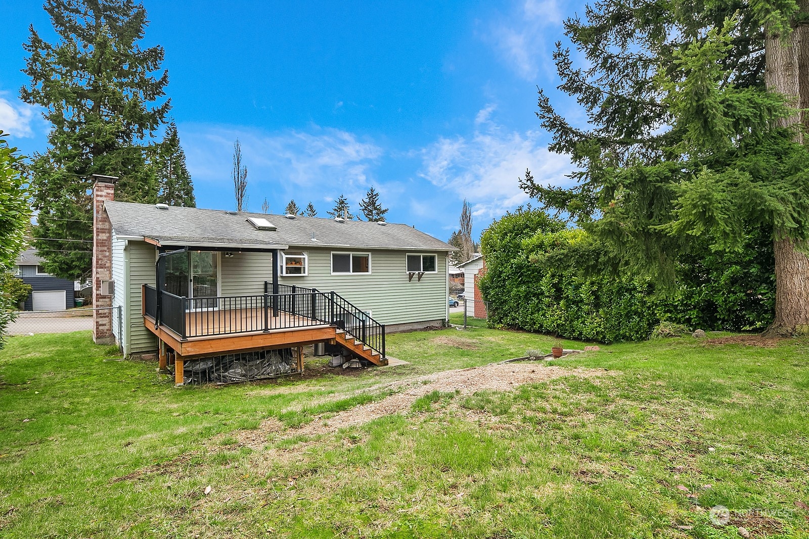 12728 Southeast 163rd Street Renton, WA 98058 - Photo 27 of 40 a front view of a house with garden