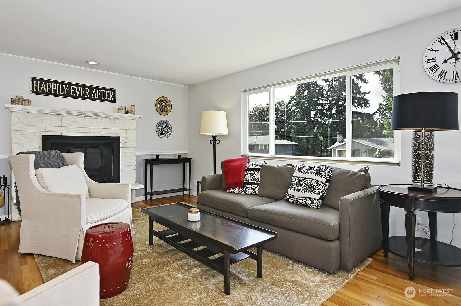 12728 Southeast 163rd Street Renton, WA 98058 - Photo 3 of 40 a living room with furniture fireplace and a large window
