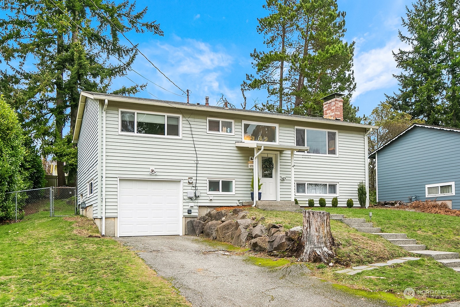 12728 Southeast 163rd Street Renton, WA 98058 - Photo 40 of 40 a front view of a house with a yard