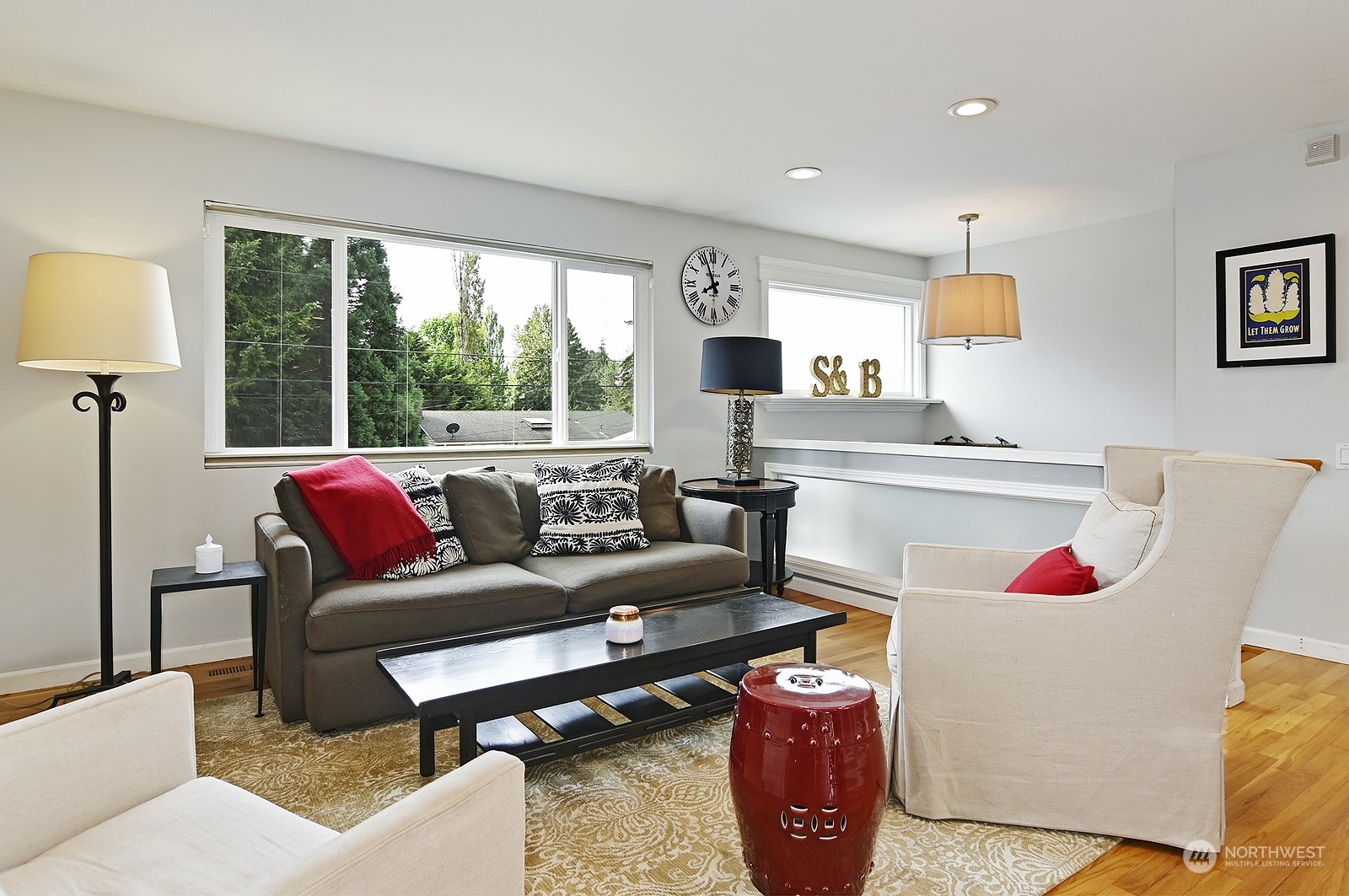 12728 Southeast 163rd Street Renton, WA 98058 - Photo 4 of 40 a living room with furniture a flat screen tv and a table