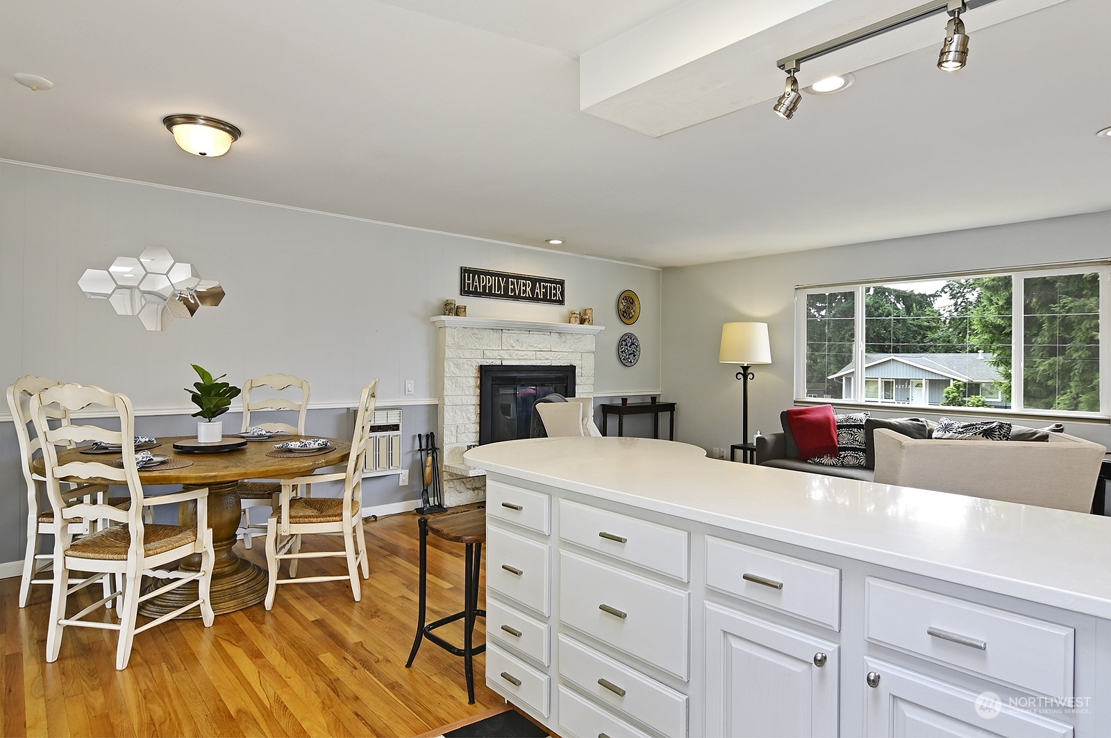 12728 Southeast 163rd Street Renton, WA 98058 - Photo 8 of 40 a kitchen with a dining table chairs and white appliances