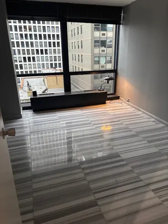 a view of wooden floor with windows