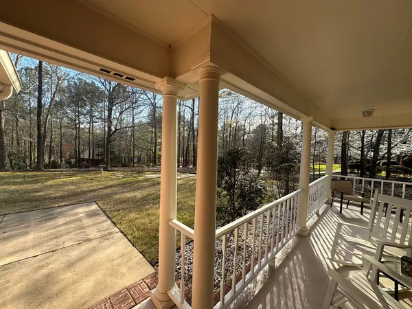 a view of a balcony with chairs