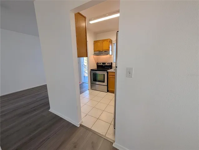 a view of a kitchen from the hallway