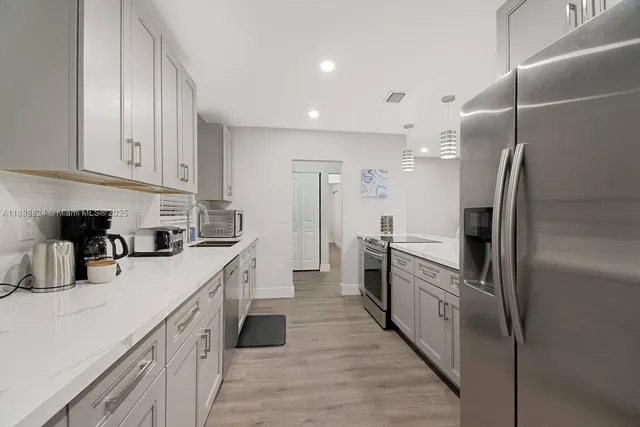 a workspace room with furniture and wooden floor